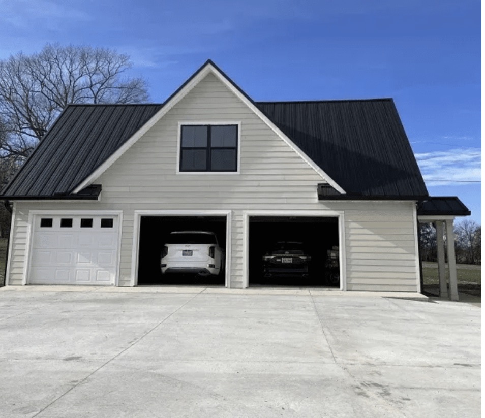 Detached two-car garage on gravel drive